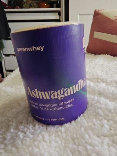 Customer's Ashwagandha bio KSM-66 purple tub on a white textured surface